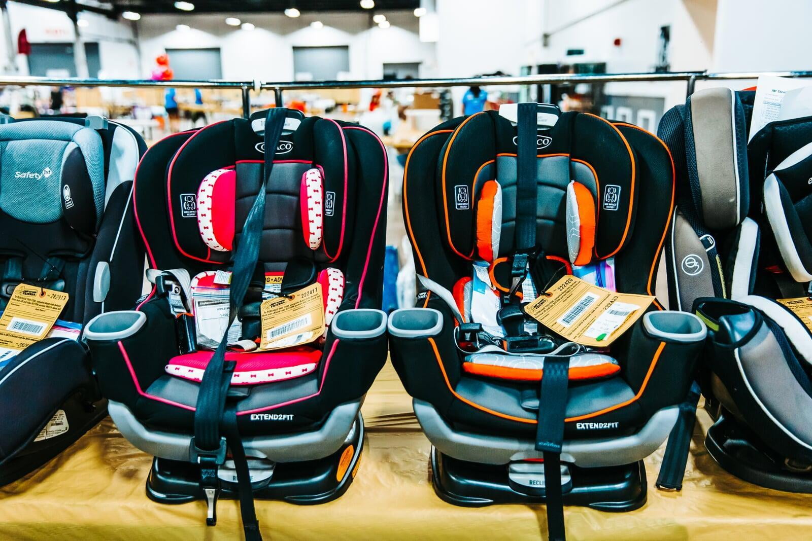 Variety of carseats displayed on the floor