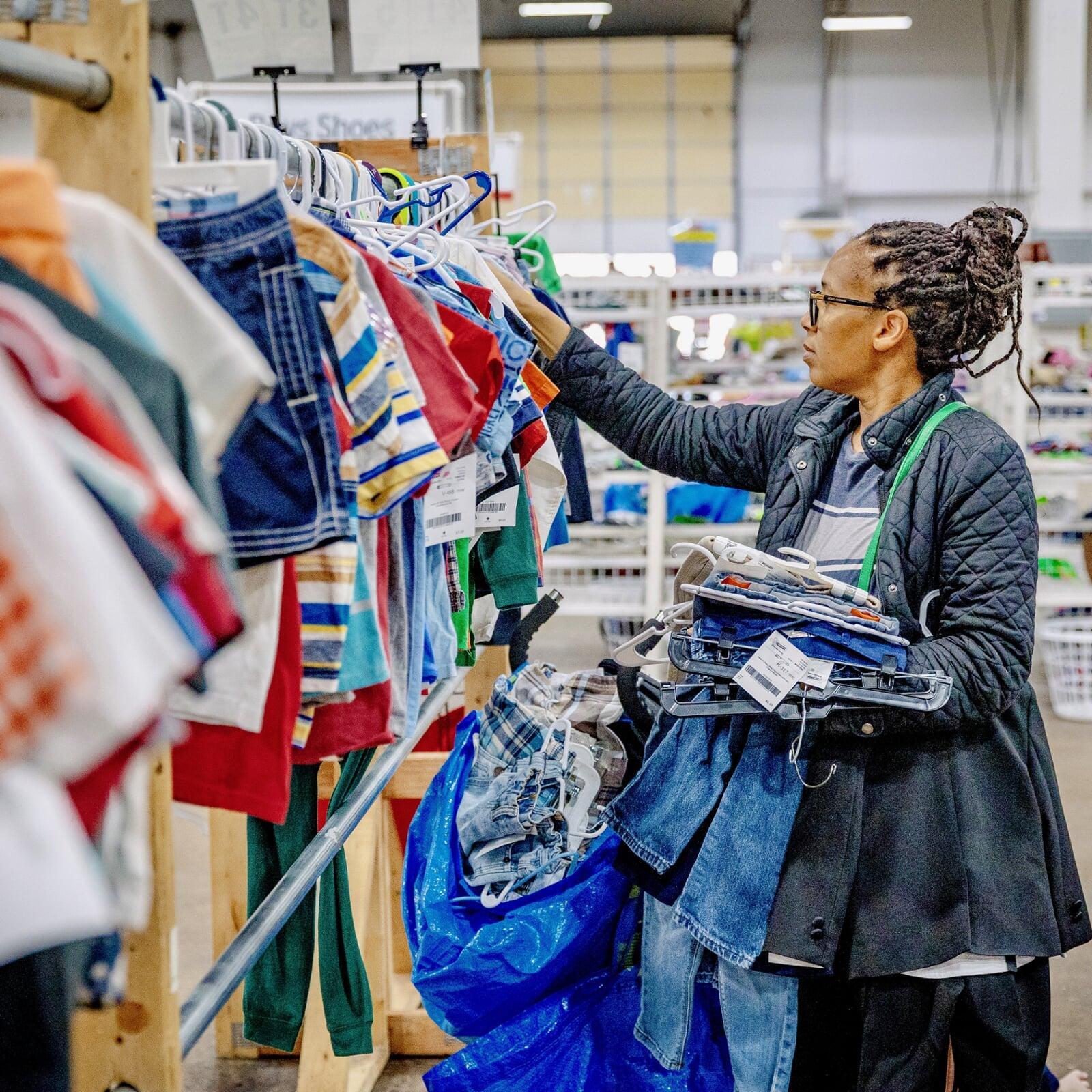 A woman shops for clothing at the JBF sale.