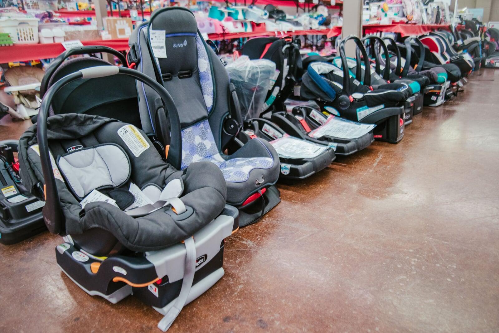 Variety of carseats displayed on the floor
