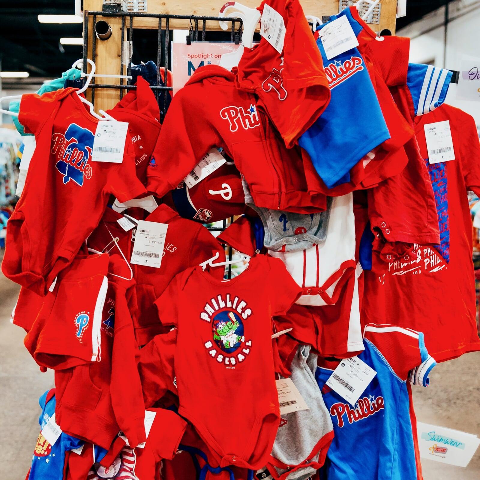 Philadelphia Phillies team wear hangs at the end of a clothing rack